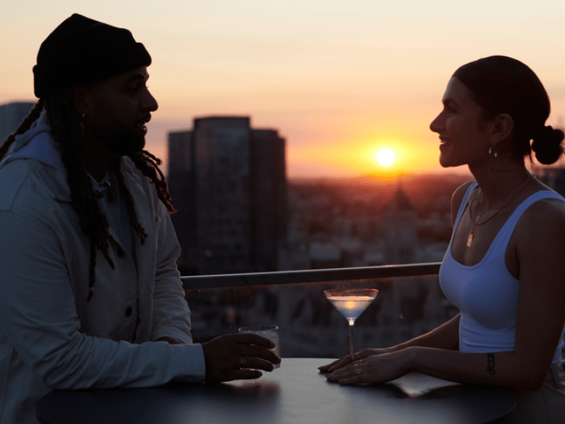 Couple sitting at Harriets rooftop bar 