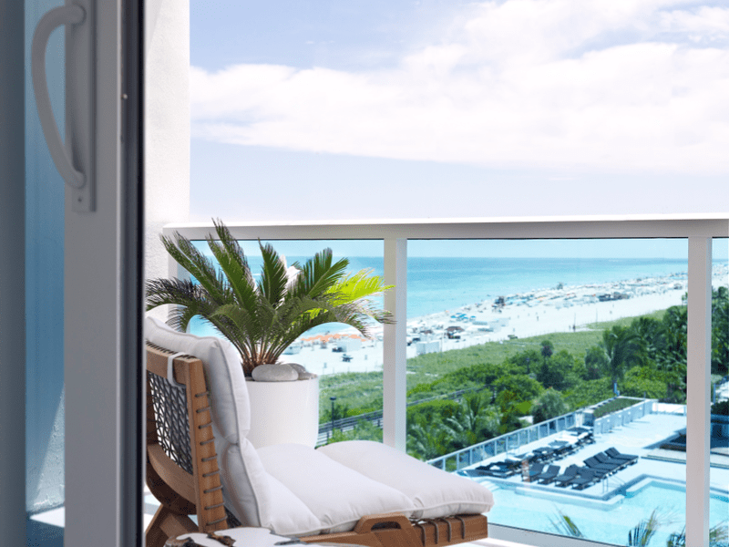 Ocean View Jr Suite King Bed With Balcony overlooking the water and beachfront