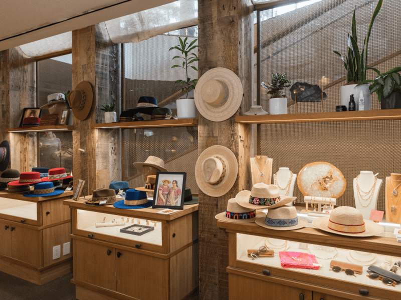 Displays in a store with hats and jewelry