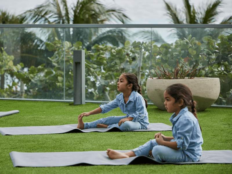 Children doing yoga outside
