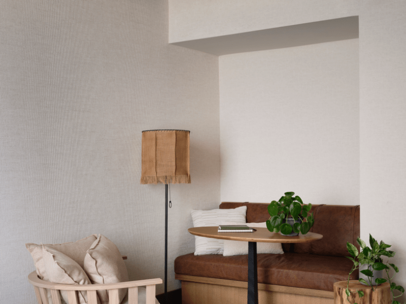Seating area with desk in corner of room