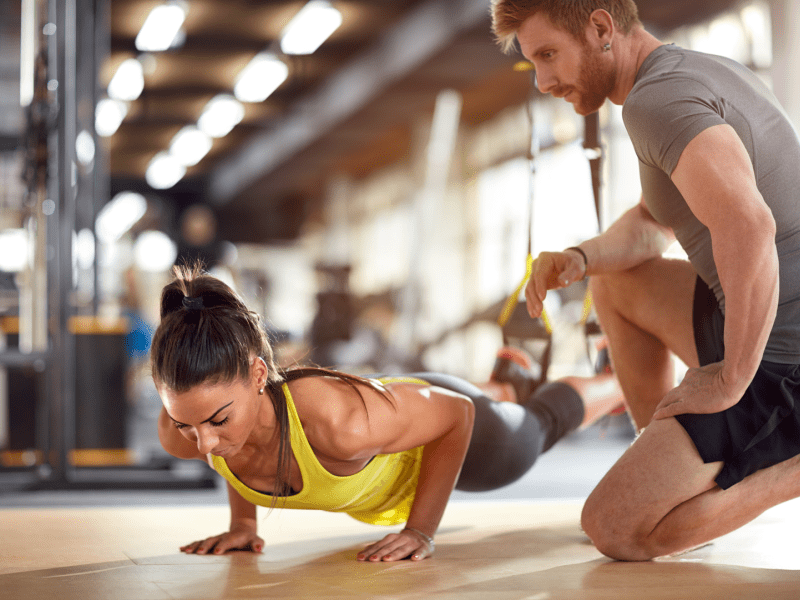 Two people working out in a gym