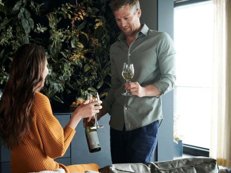 Two people having a glass of wine.