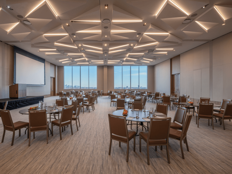 Conference room with circular tables and wide rectangular windows