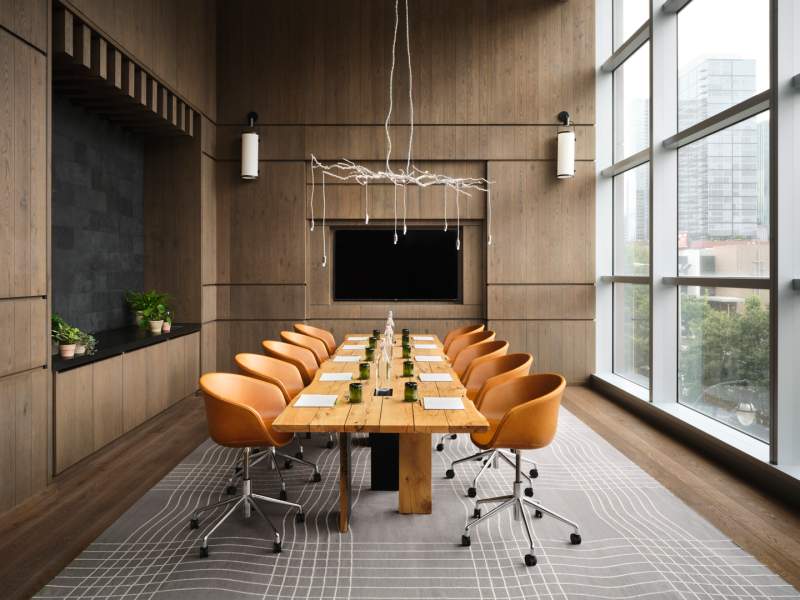Live edge meeting table with chairs lined on opposite sides