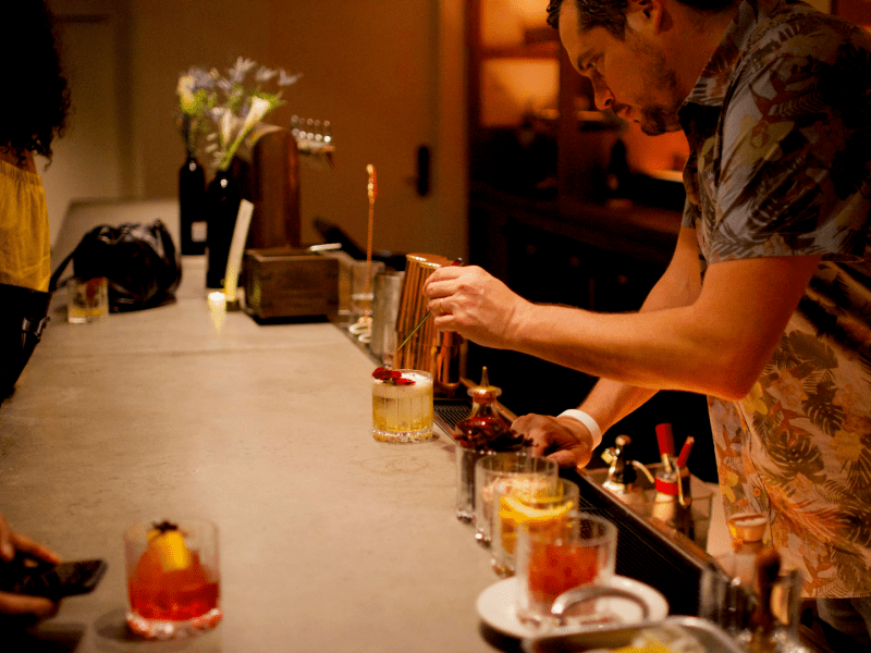 Bartender finishing up a drink