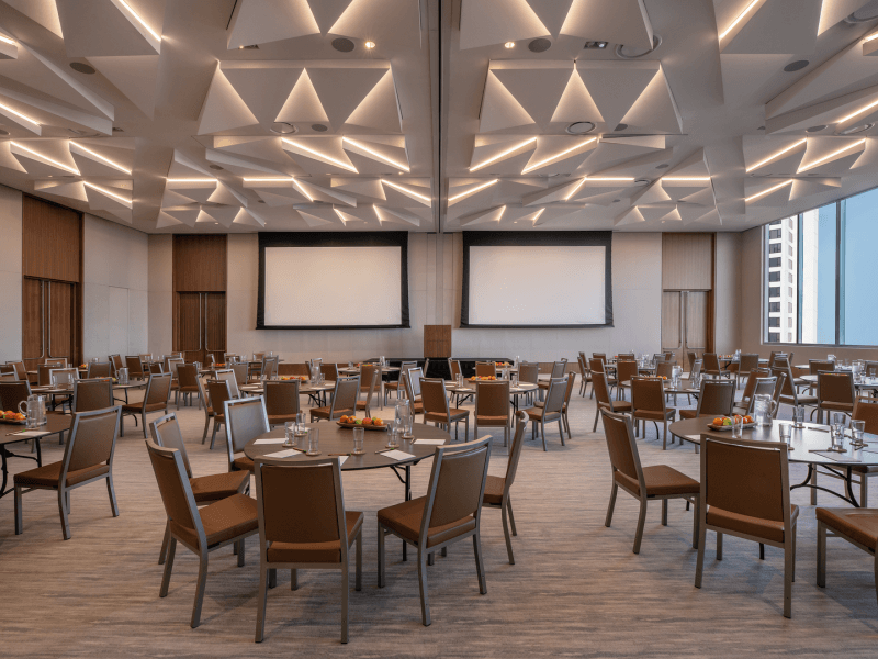 Dining room with circular tables set for six