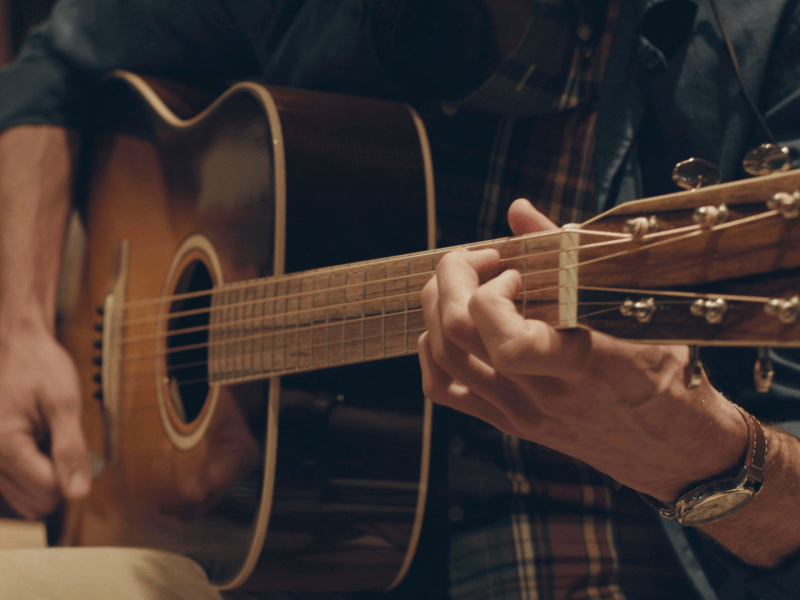 Person playing guitar