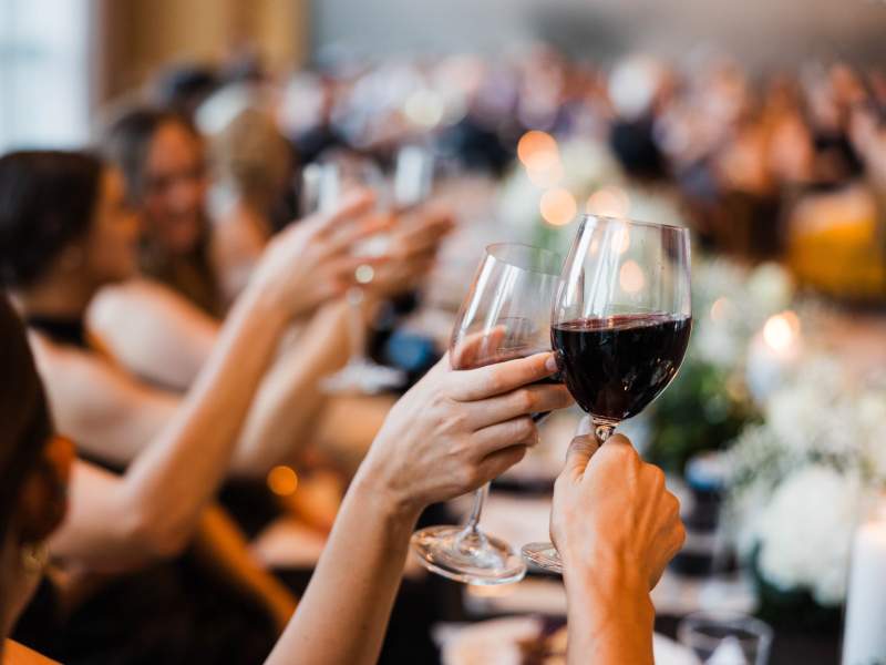 wedding guest toasting to the bride and groom