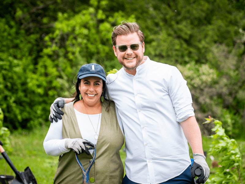 Two people wearing gloves posing for a photo