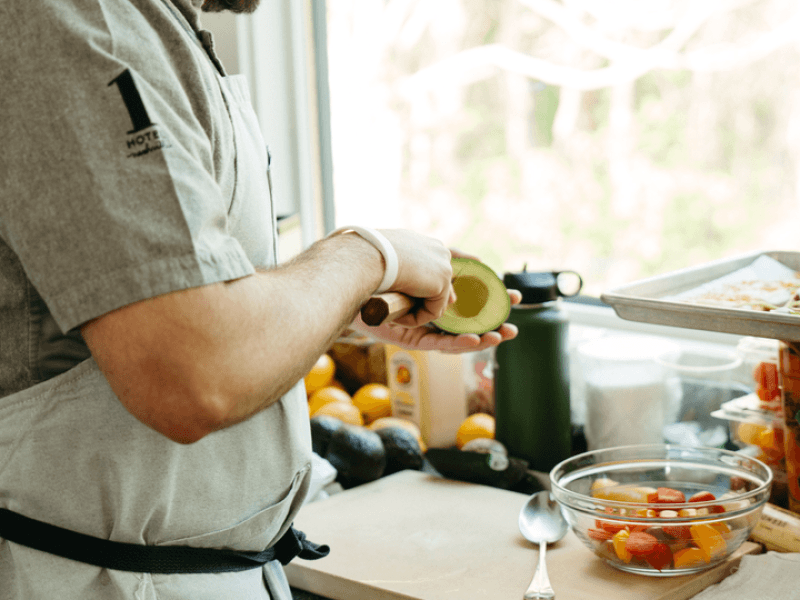 a chef preparing an avocado