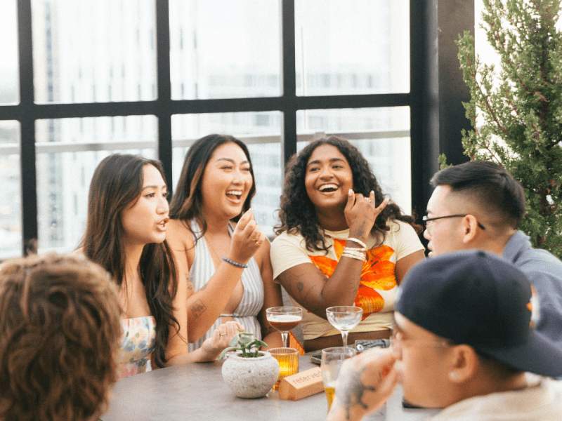 friends hanging out on an outdoor rooftop