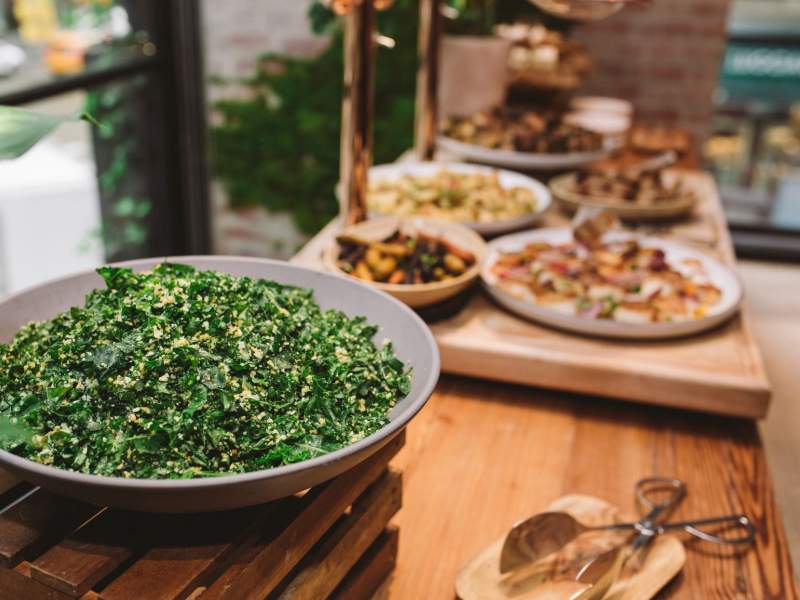 table filled with large serving platers of food