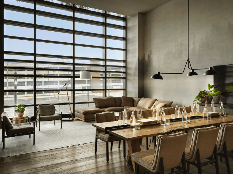 A set dining table in front of a sectional couch