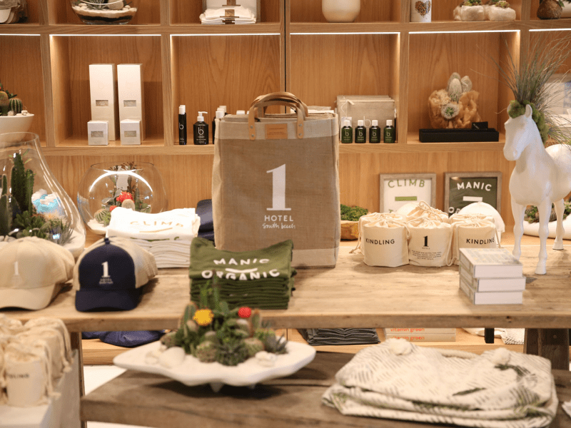 A display at a store with bags, hats and candles