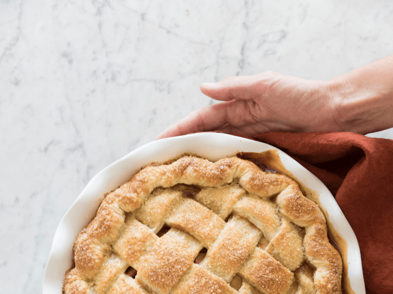 Hands holding a pie