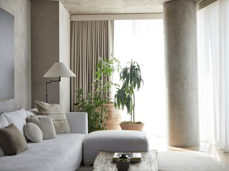 A couch with an ottoman and coffee table