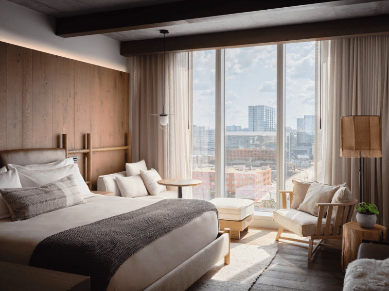 Wide windows allow in plenty of natural light, bathing the king size bed in sun