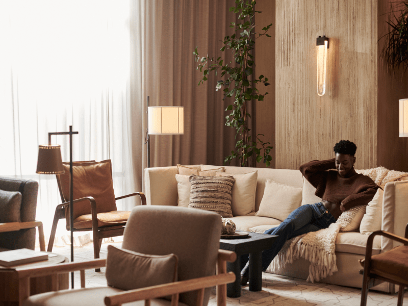 Person sitting on a beige couch