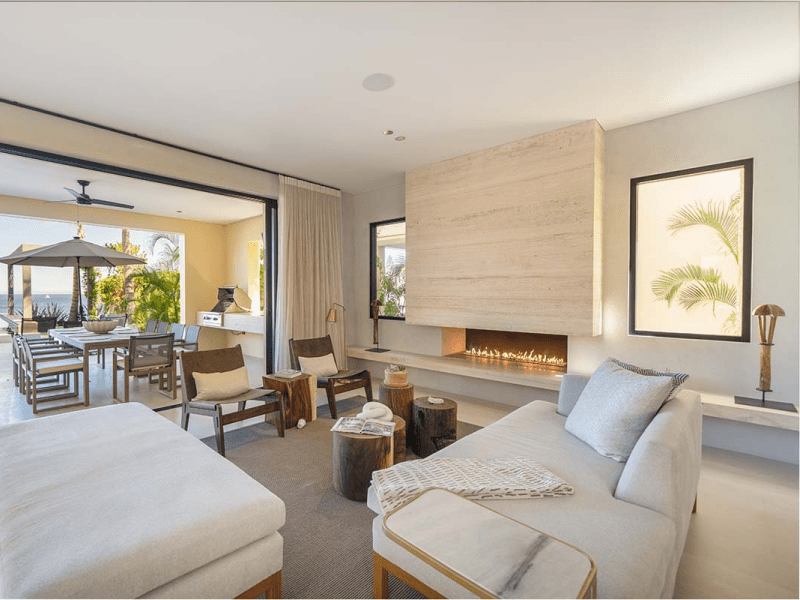 A living room with couches and a fireplace