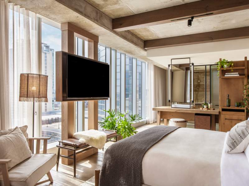 hotel room with floor to ceiling windows