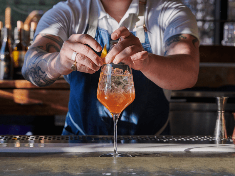 bartender garnishing drink