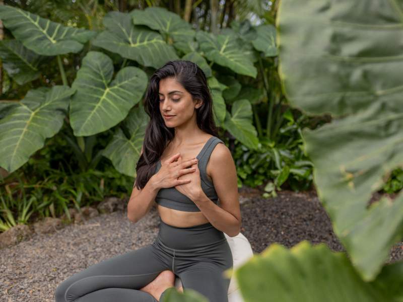 Women meditating outside