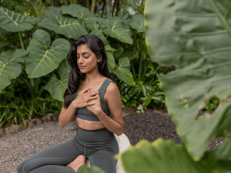 Women meditating outside