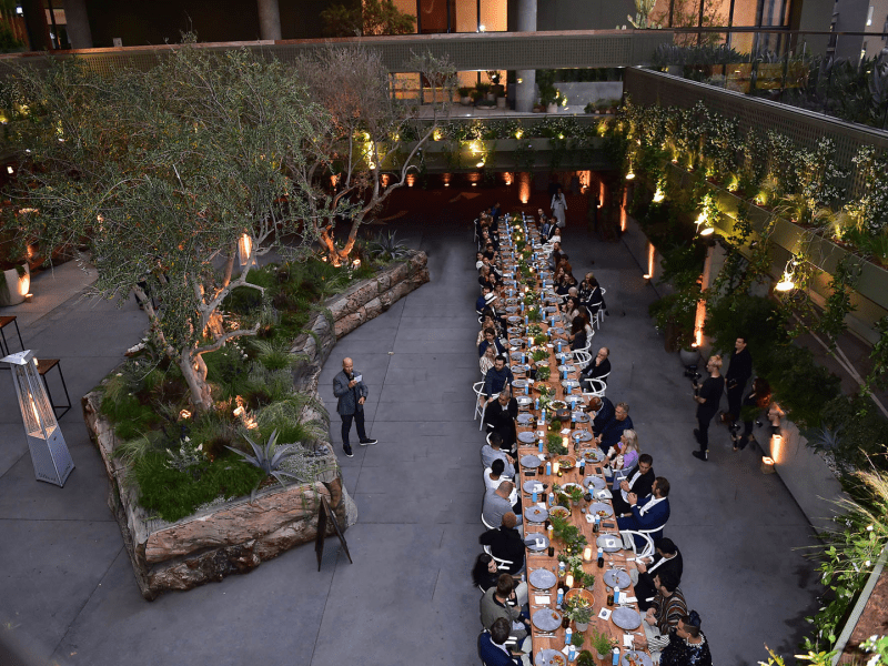 Birdseye view of a group of people at a long dinner table