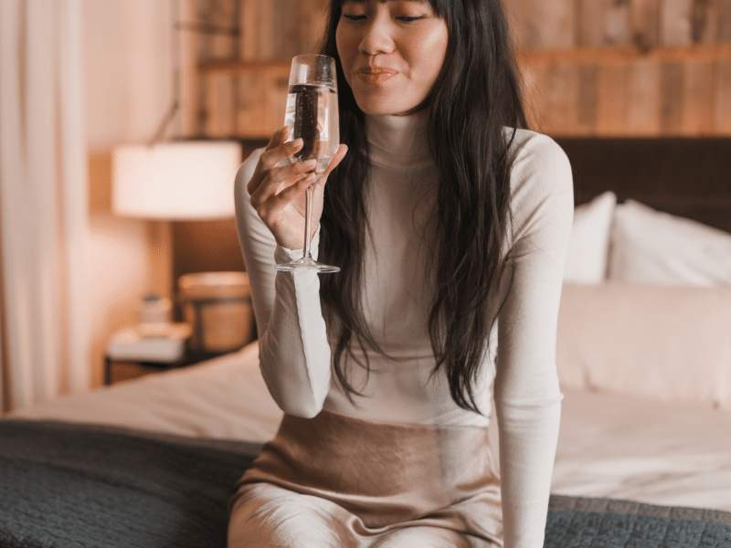 girl sitting on bed