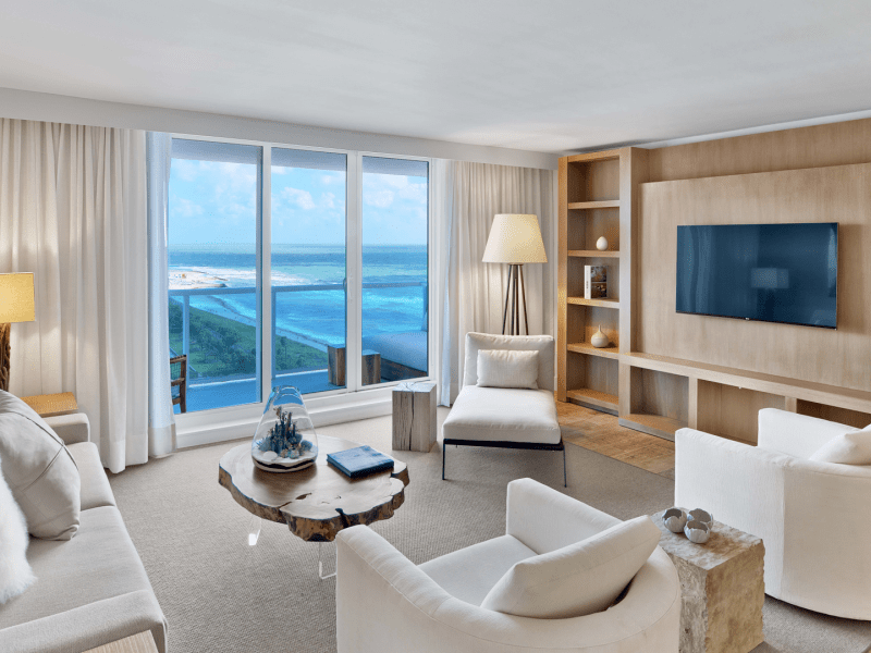 Living room area with a large window out to the ocean
