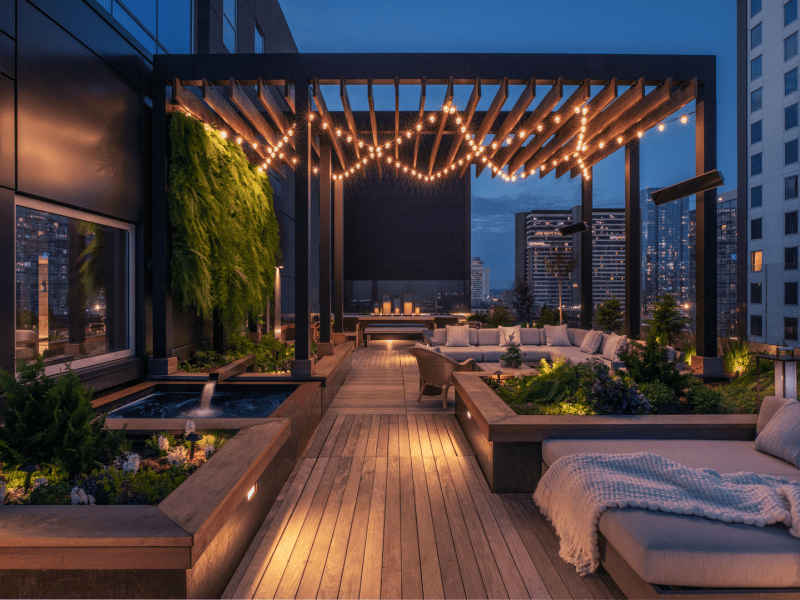 Dimly lit terrace lounge area at nigh