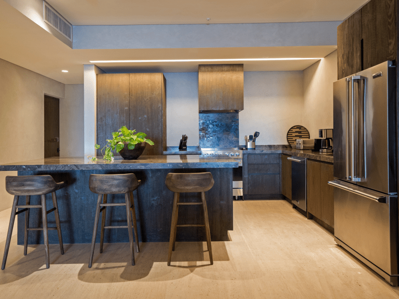 Dark colored modern kitchen with an island