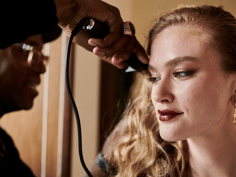 Woman getting her hair styled