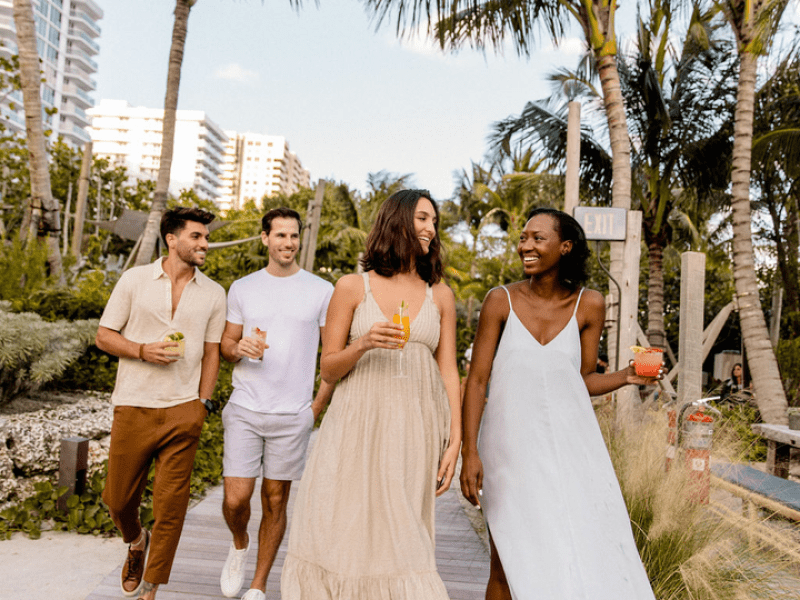 Group of people walking along a boardwalk
