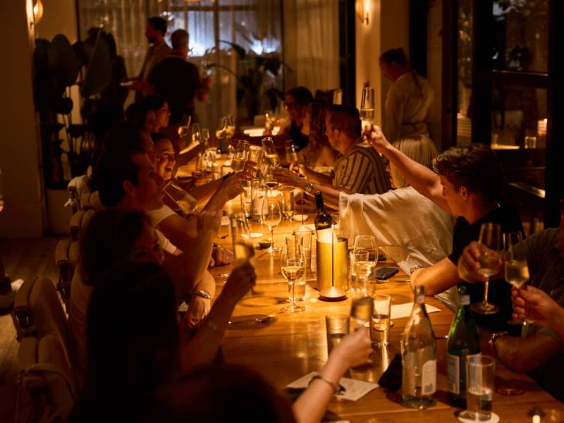 Private dinner with guests sitting around the table