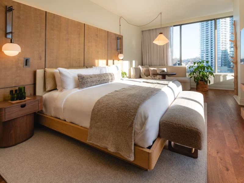 hotel room with bed and natural light