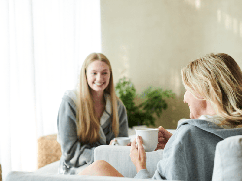 Two people having coffee and talking