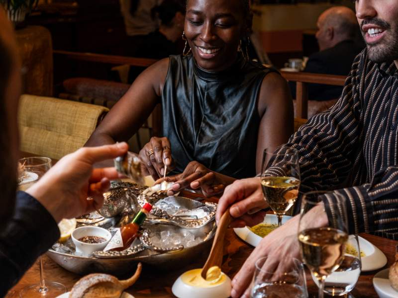 People having dinner and smiling