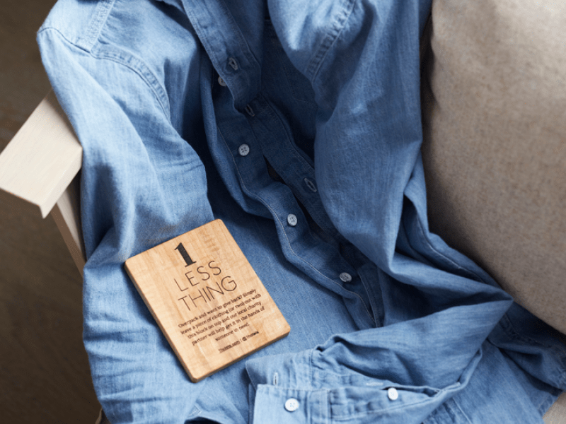 Second-hand shirt with "1 Less Thing" label