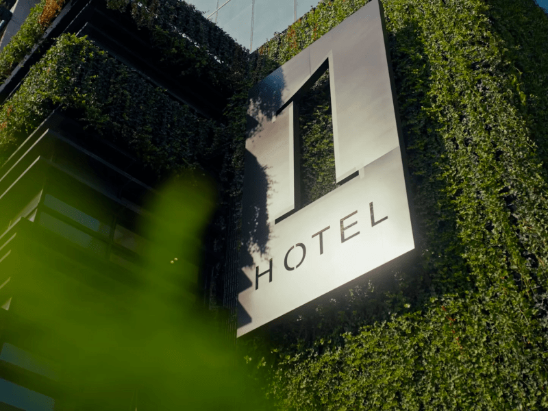 1 Hotels sign on the side of 1 Hotel Nashville