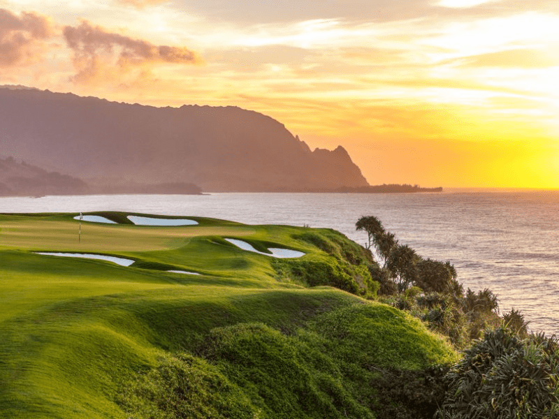 sunset over a golf course