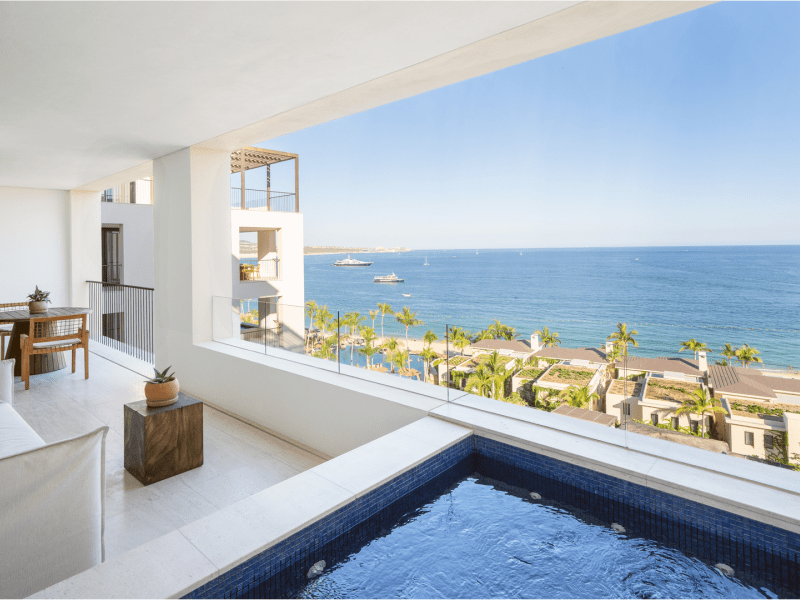 Covered outdoor patio with a person pool