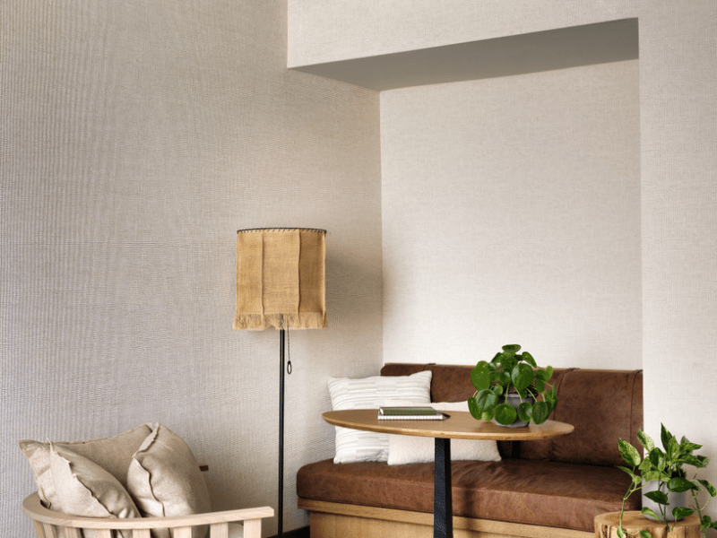 Corner seating nook with table and lamp