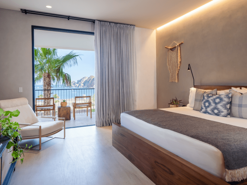 King bedroom with views of the ocean from a private patio