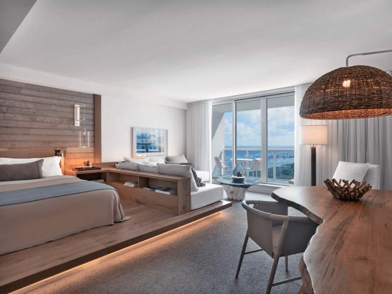 Bedroom with a sectional couch and chair