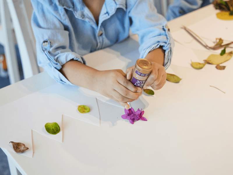 Person using a tube of glue