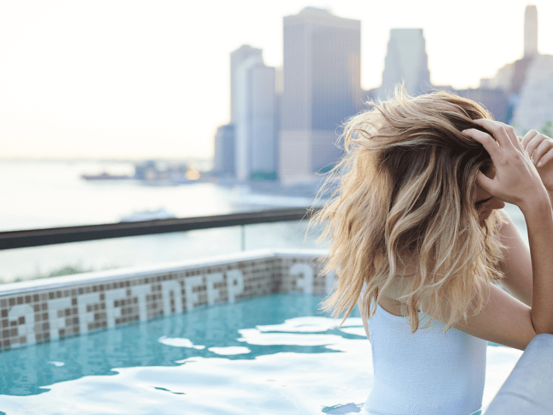 Woman in a rooftop pool 