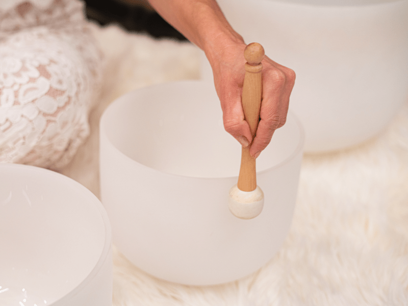 Person using a singing bowl