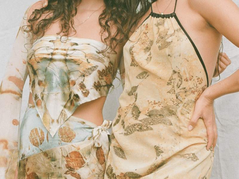 Two girls wearing dresses